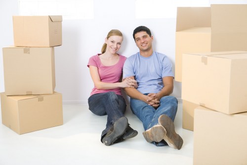 Careful loading of household items into a local moving van