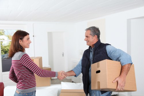 Loading furniture into a removals van in St Jamess