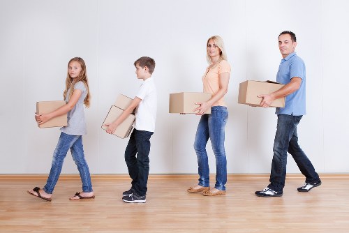 Helper carrying boxes during a St Jamess man and van booking